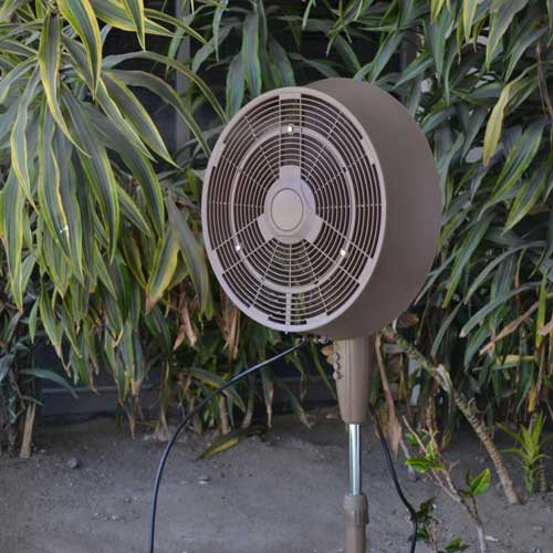 misting fan provides a cooling mist in hot weather